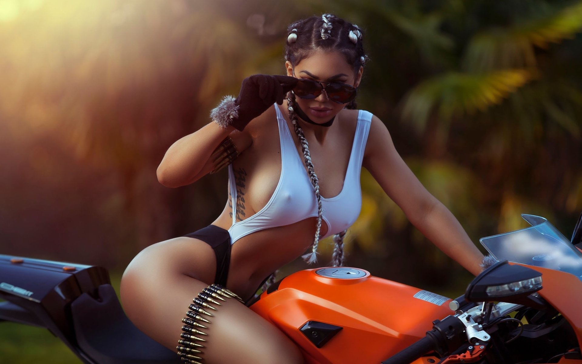 Girls with tattoos and motorcycles in Yaounde
